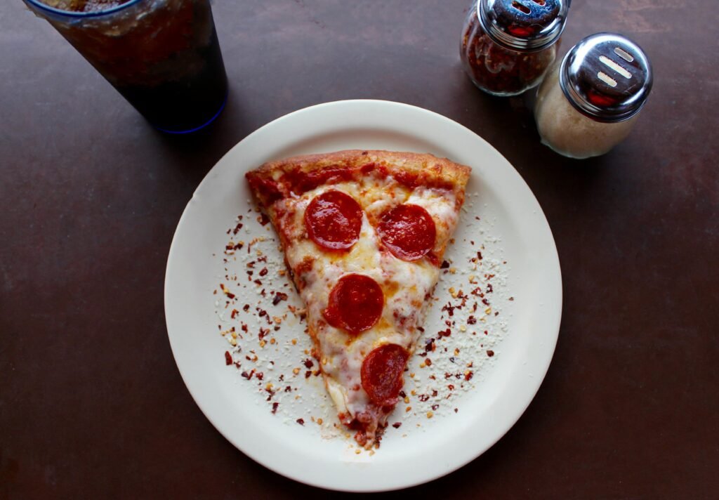 pexels-photo-708587-708587 A mouthwatering slice of pepperoni pizza with cheese and spices, ideal for any meal.